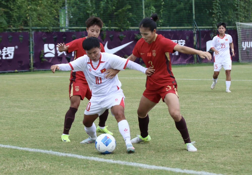 ĐT nữ Việt Nam thua ĐT nữ Trung Quốc trong trận giao hữu trước thềm ASIAD 2026 - Ảnh 2. ĐT nữ Việt Nam thua ĐT nữ Trung Quốc trong trận giao hữu trước thềm ASIAD 2026 - Ảnh 2.