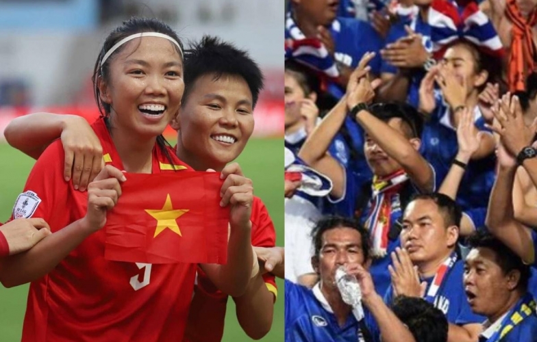 Thai fans react in unison after a 1-3 defeat against Vietnam