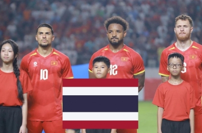 Southeast Asian football fans shout Vietnam's name as they share a group with Thailand in the FIFA tournament