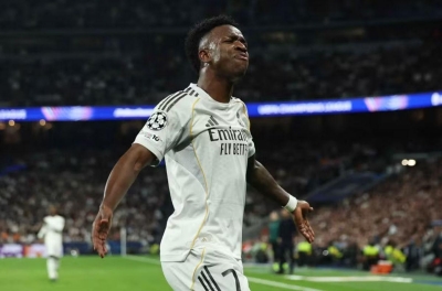 Vinicius shines as Real Madrid advances to the Champions League round of 16