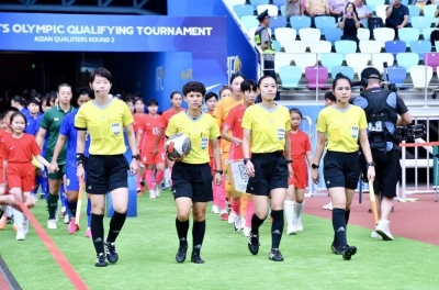 Vietnamese referees officiate a crucial match at the Asian Cup