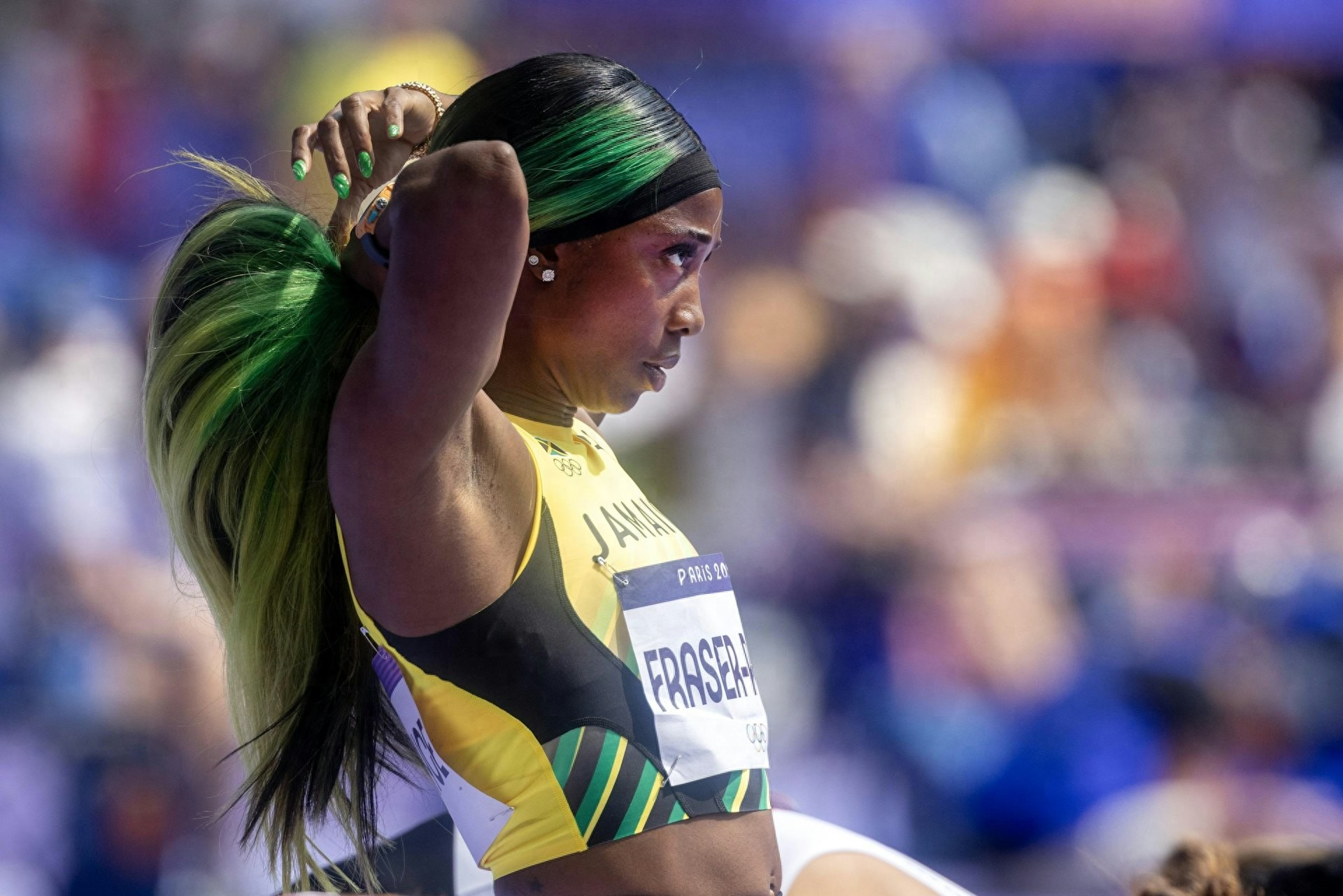 Frazier, a Jamaican flyer, participates in her son's school parent-child athletic meet, ruthlessly crushing other parents