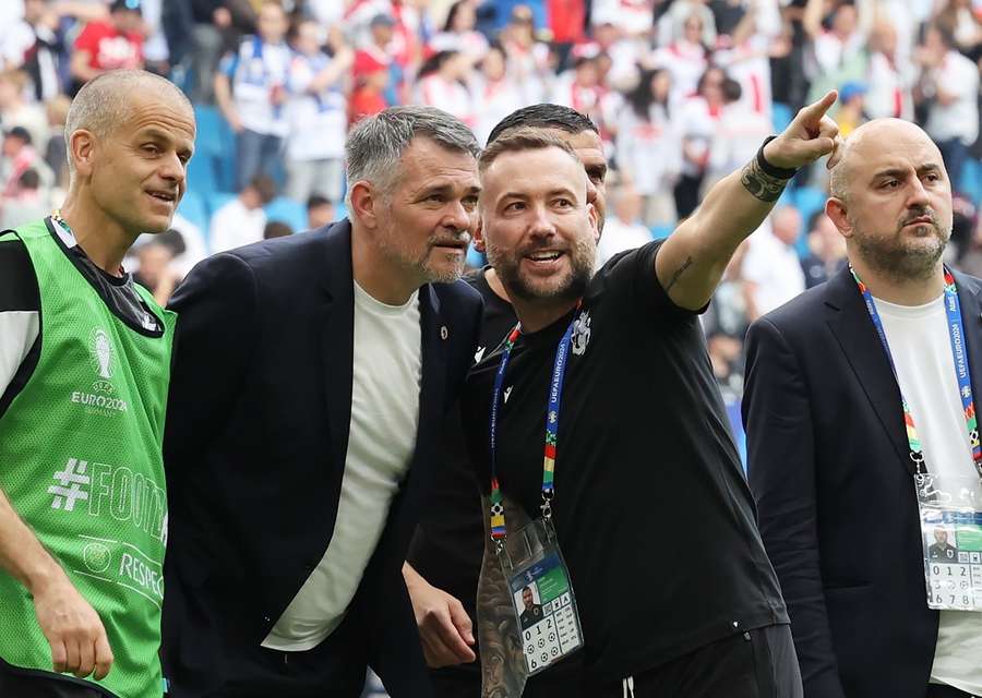 Webb (pointing) alongside Goergia manager Willy Sagnol