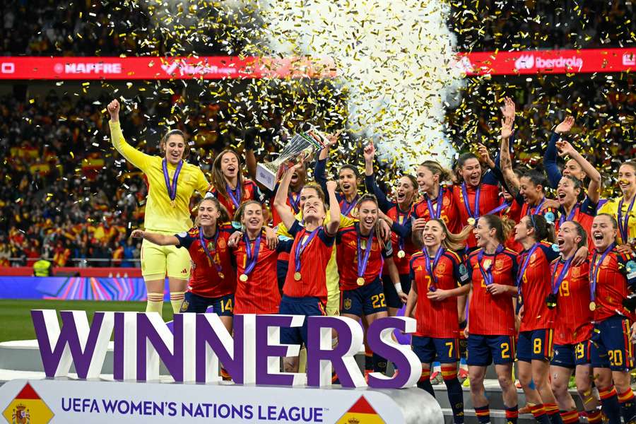 Spain's players celebrate with the trophy after winning the UEFA Women's Nations League 