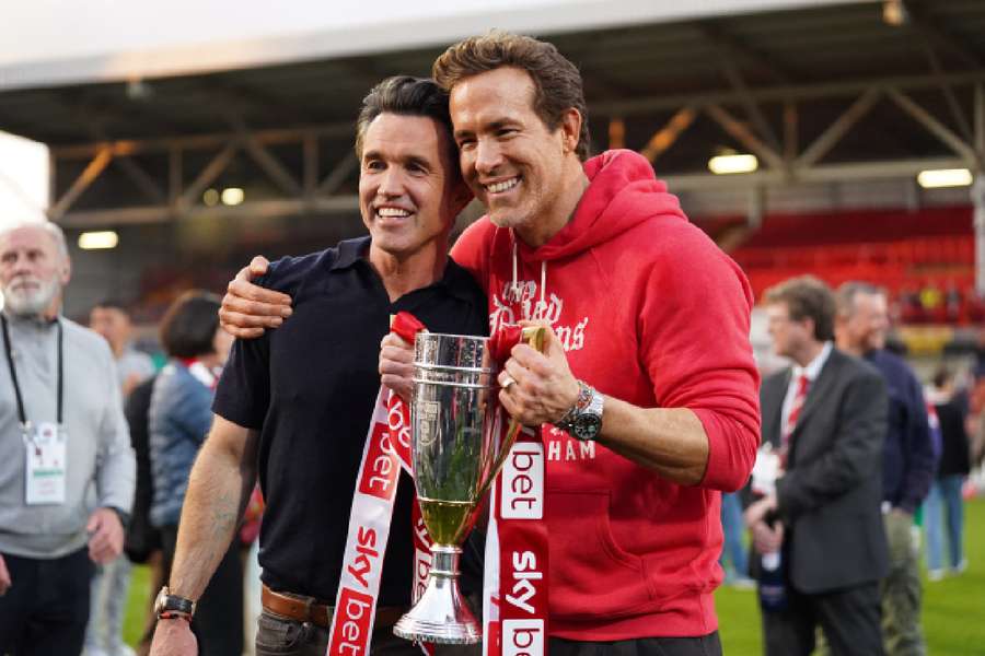Ryan Reynolds and  Rob McElhenney celebrate Wrexham's promotion to the Championship