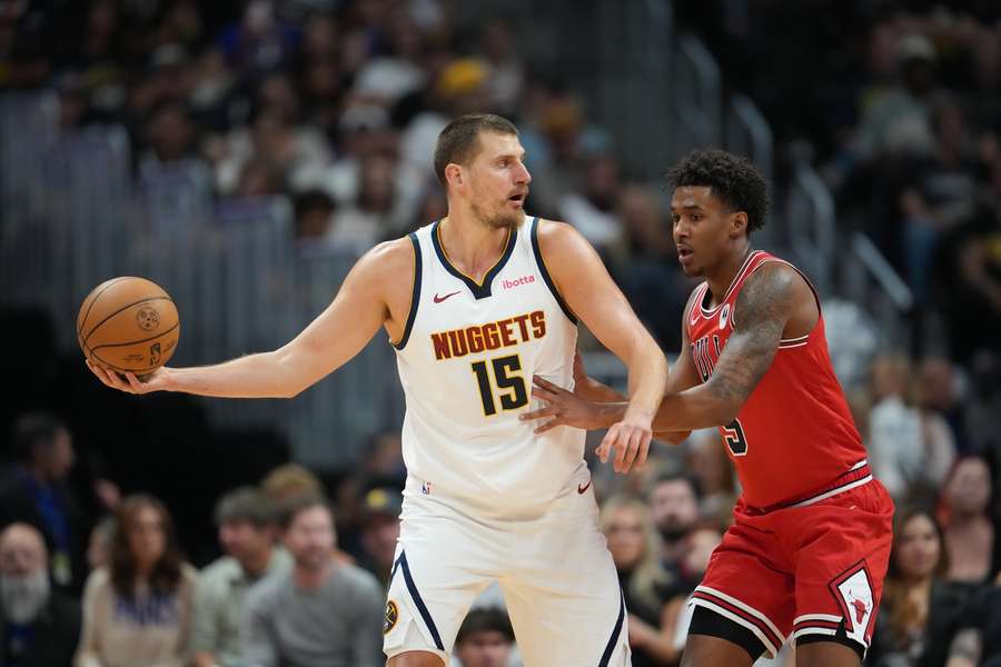 Center Nikola Jokic is looking to pass the ball against the Chicago Bulls in the preseason Center Nikola Jokic is looking to pass the ball against the Chicago Bulls in the preseason