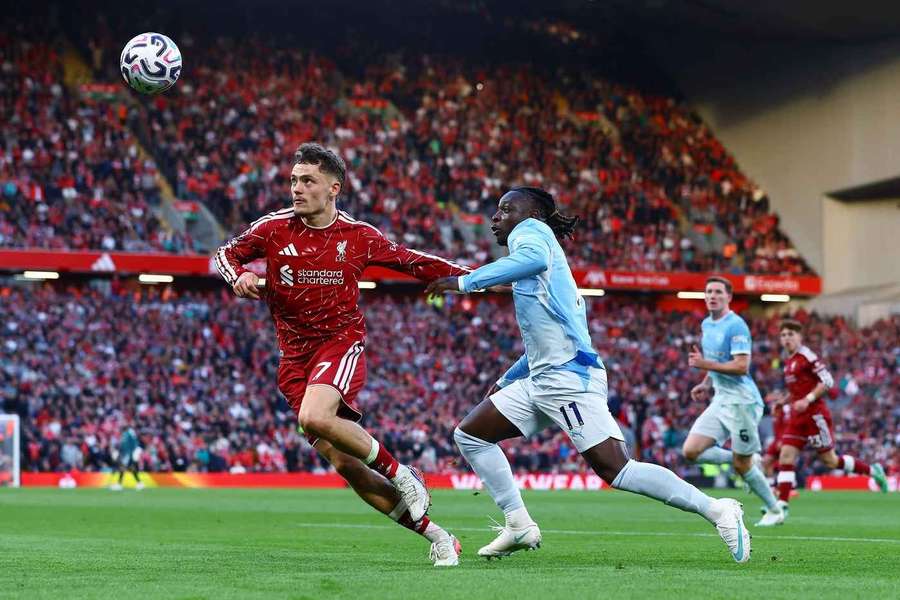 Liverpool's Florian Wirtz clashes with Man City's Jeremy Doku 