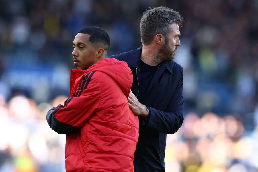 Tielemans (L) embraces Carrick Tielemans (L) embraces Carrick