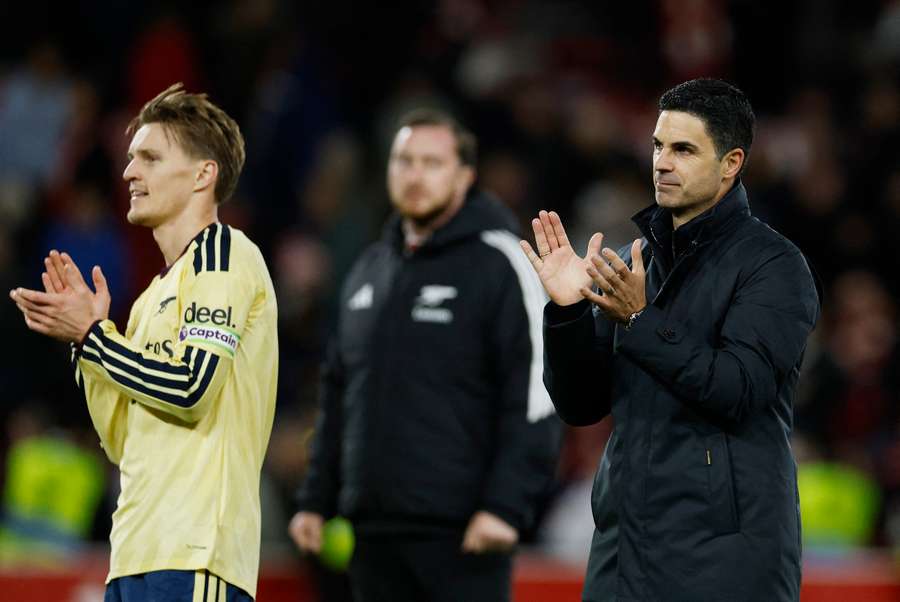 Arsenal's Martin Odegaard and manager Mikel Arteta applaud fans after the match Arsenal's Martin Odegaard and manager Mikel Arteta applaud fans after the match