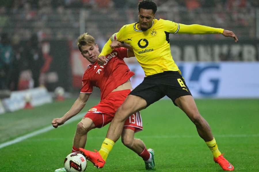 Dortmund's Nmecha battles for the ball Dortmund's Nmecha battles for the ball