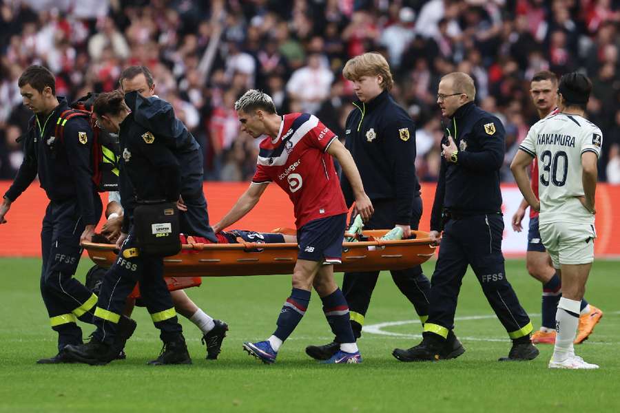 Santos being stretchered off