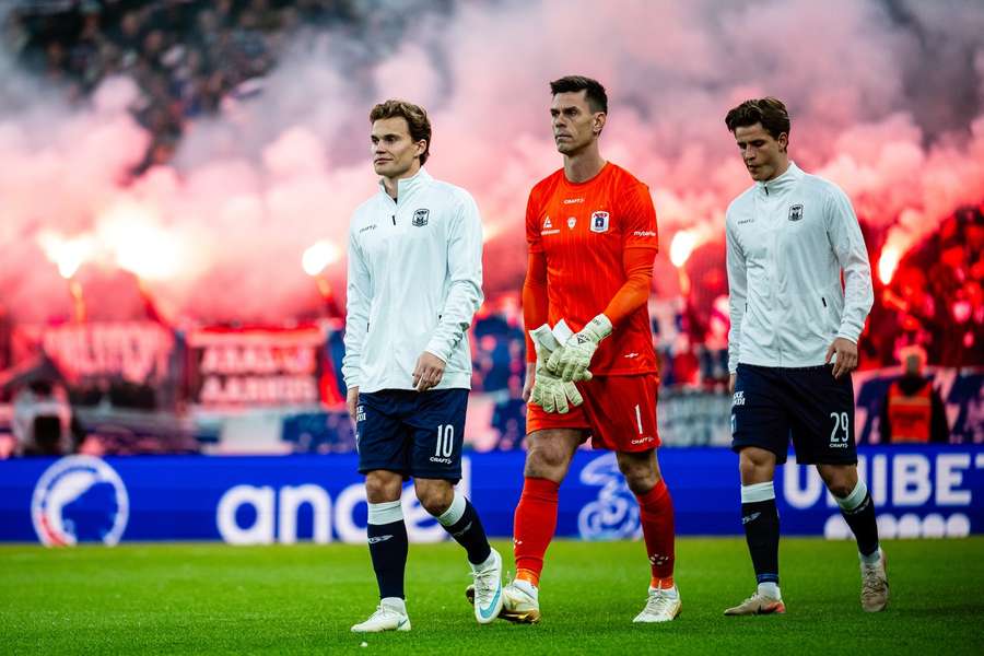 Captain Kristian Arnstad and players of AGF enter the pitch for the match against FC Copenhagen. Captain Kristian Arnstad and players of AGF enter the pitch for the match against FC Copenhagen.