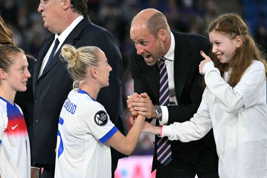 Prince William shakes hands with England defender Alex Greenwood after the Euro 2025 final
