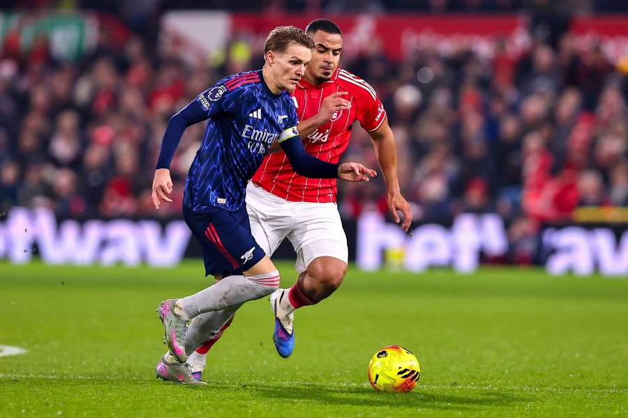 Arsenal's Martin Odegaard is put under pressure by Nottingham Forest's Murillo Arsenal's Martin Odegaard is put under pressure by Nottingham Forest's Murillo