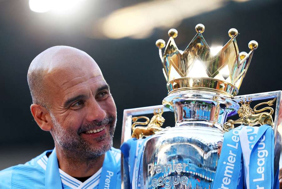 Former Manchester City manager Pep Guardiola with the Premier League trophy Former Manchester City manager Pep Guardiola with the Premier League trophy