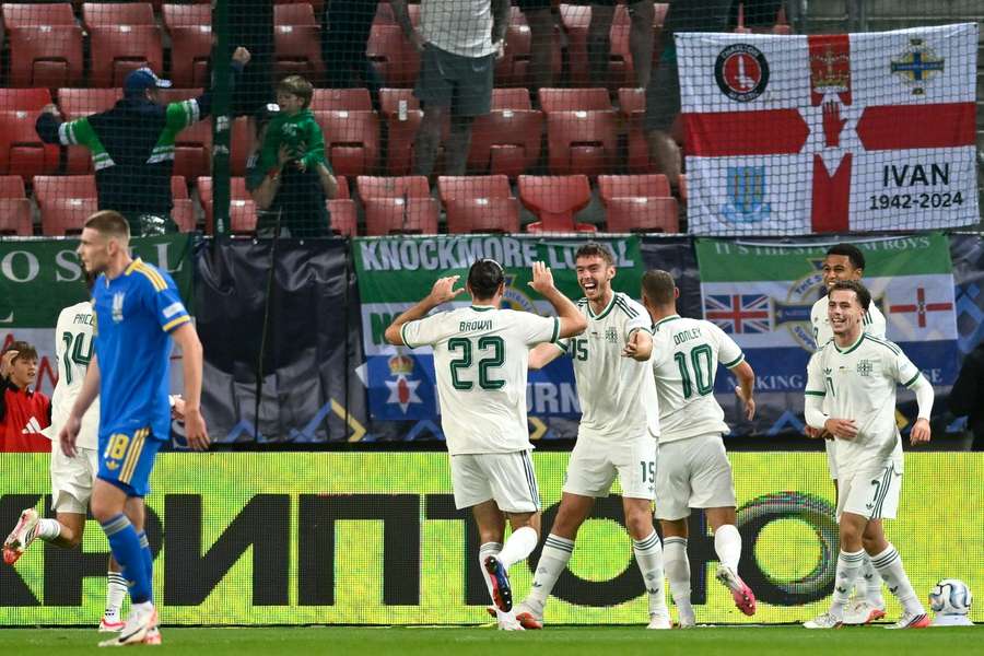 Brown (centre) celebrates with teammates after scoring for Northern Ireland against Ukraine Brown (centre) celebrates with teammates after scoring for Northern Ireland against Ukraine
