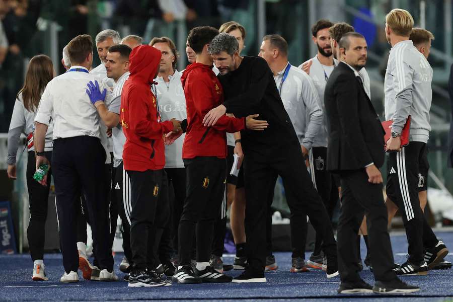 Van Bommel (centre) celebrates after a win over Italy