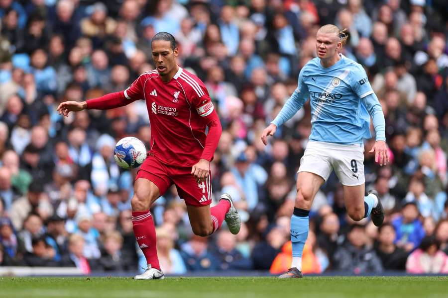 Liverpool's Virgil van Dijk in action against Man City's Erling Haaland Liverpool's Virgil van Dijk in action against Man City's Erling Haaland