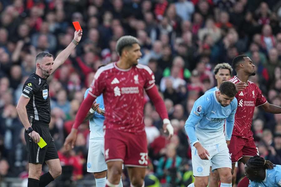 Referee Chris Kavanagh shows a red card to Liverpool's Ryan Gravenberch during the match against Manchester City Referee Chris Kavanagh shows a red card to Liverpool's Ryan Gravenberch during the match against Manchester City