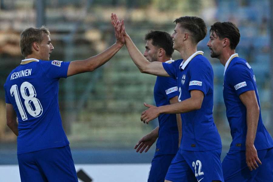 Adrian Svanback (22) celebrates a debut goal for Finland