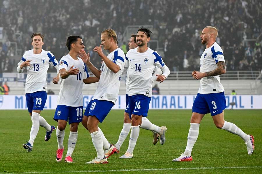 Finland players celebrate Leo Walta's (10) equaliser Finland players celebrate Leo Walta's (10) equaliser