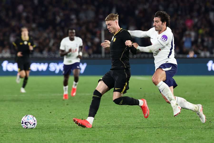 Chelsea's Cole Palmer is challenged by Tottenham's Sandro Tonali