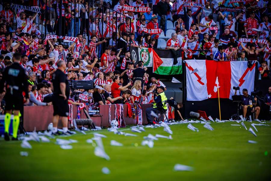 Saturday's game ‌was halted after 13 minutes as fans threw paper planes and rubber balls onto the ‌pitch in protest