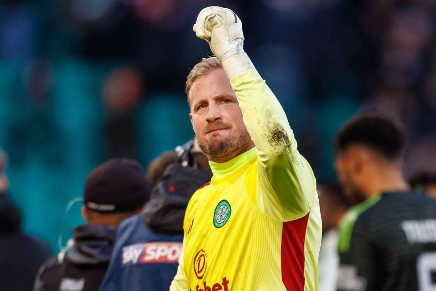 Celtic Goalkeeper Kasper Schmeichel celebrates with fans 