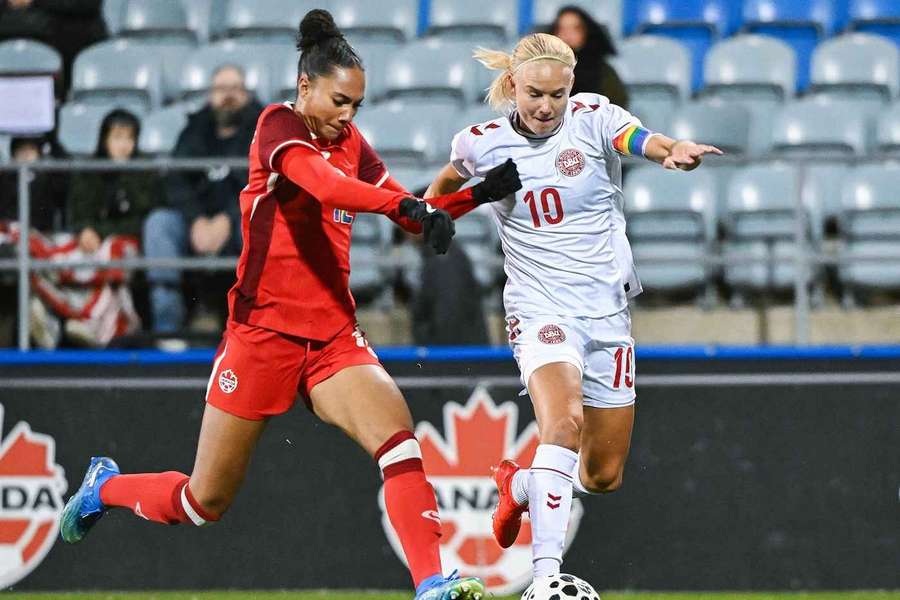 Canada's Jade Rose, left, and Denmark's Pernille Harder tussle for the ball Canada's Jade Rose, left, and Denmark's Pernille Harder tussle for the ball