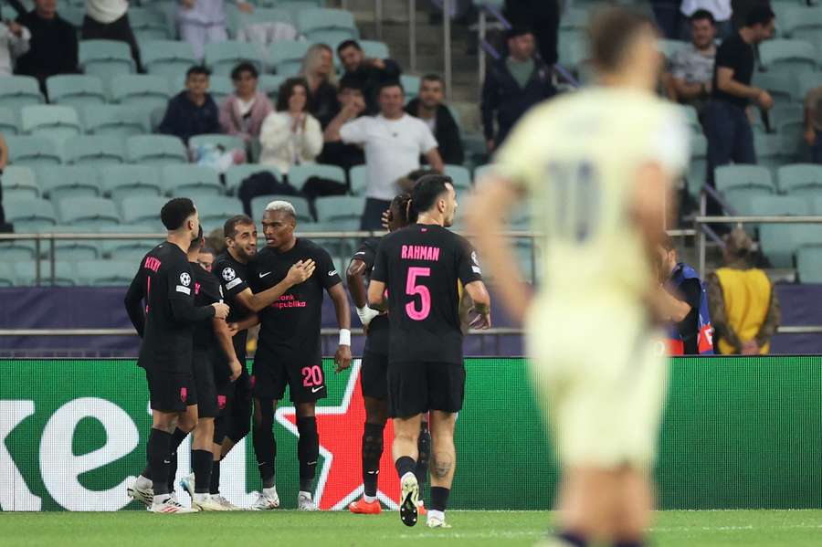Sabah's Joy-Lance Mickels celebrates scoring their second goal with teammates Sabah's Joy-Lance Mickels celebrates scoring their second goal with teammates