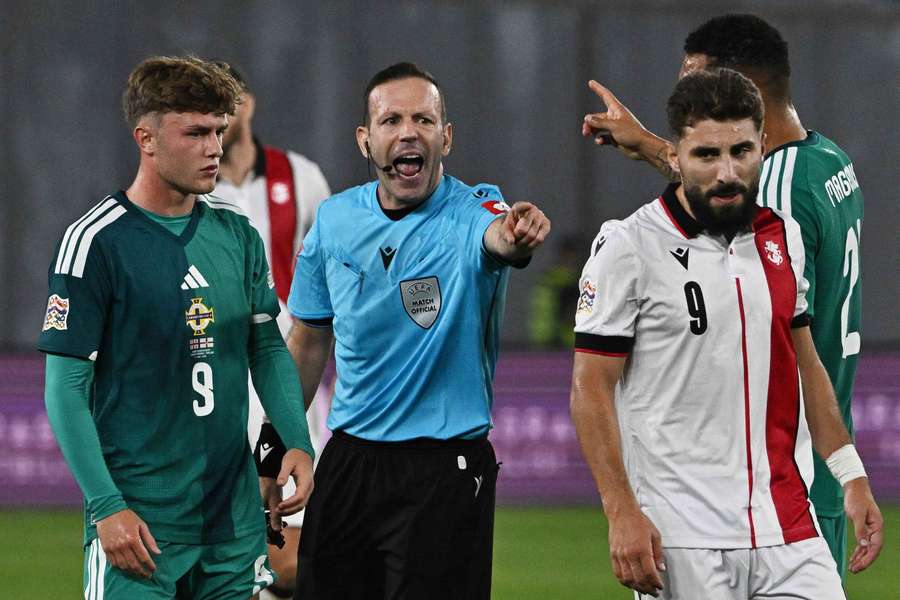 Referee Orel Grinfeeld, centre, reacts Referee Orel Grinfeeld, centre, reacts
