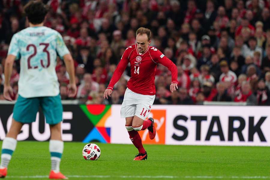 Mikkel Damsgaard attempts a shot against Portugal