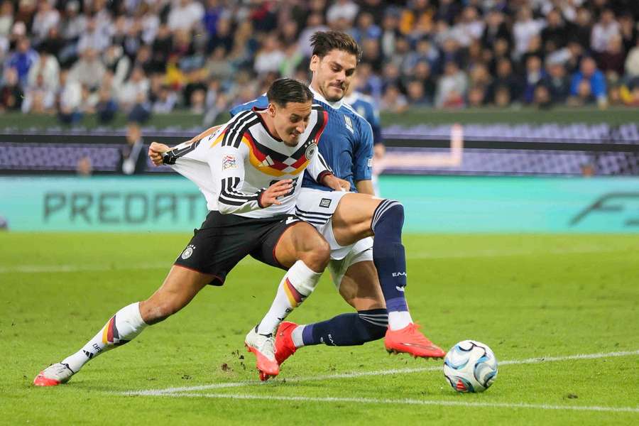 Younes Ebnoutalib of Germany and Konstantinos Mavropanos of Greece during a UEFA Nations League game Younes Ebnoutalib of Germany and Konstantinos Mavropanos of Greece during a UEFA Nations League game
