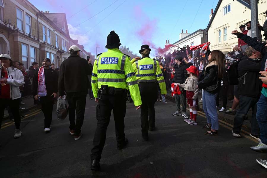 Police officers walk the streets ahead of Liverpool's game with Manchester City