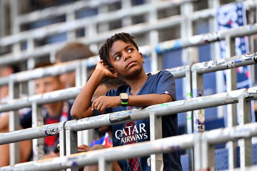 A young Paris Saint-Germain fan ahead of the UEFA Super Cup match against Aston Villa A young Paris Saint-Germain fan ahead of the UEFA Super Cup match against Aston Villa