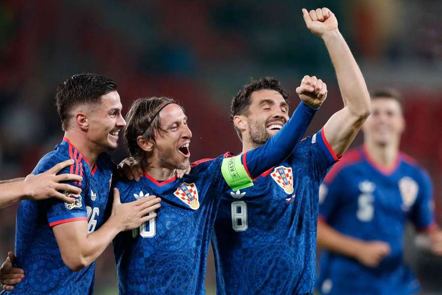Croatia's Luka Modric celebrates scoring their first goal with teammates