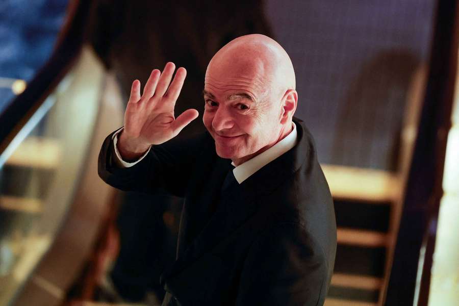 Gianni Infantino waving to the press during an AFC meeting in Tokyo this week.