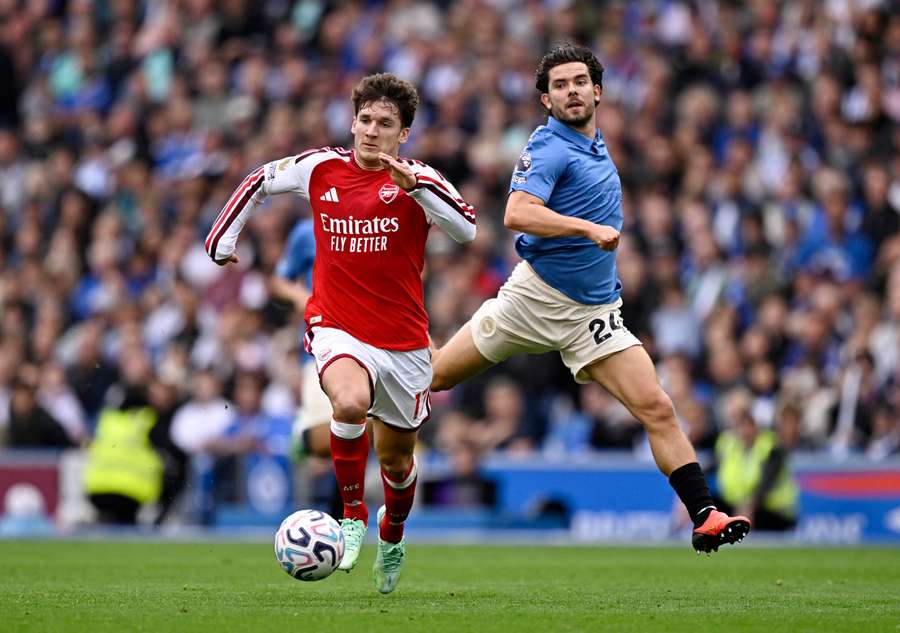 Tzolis in action with Arsenal