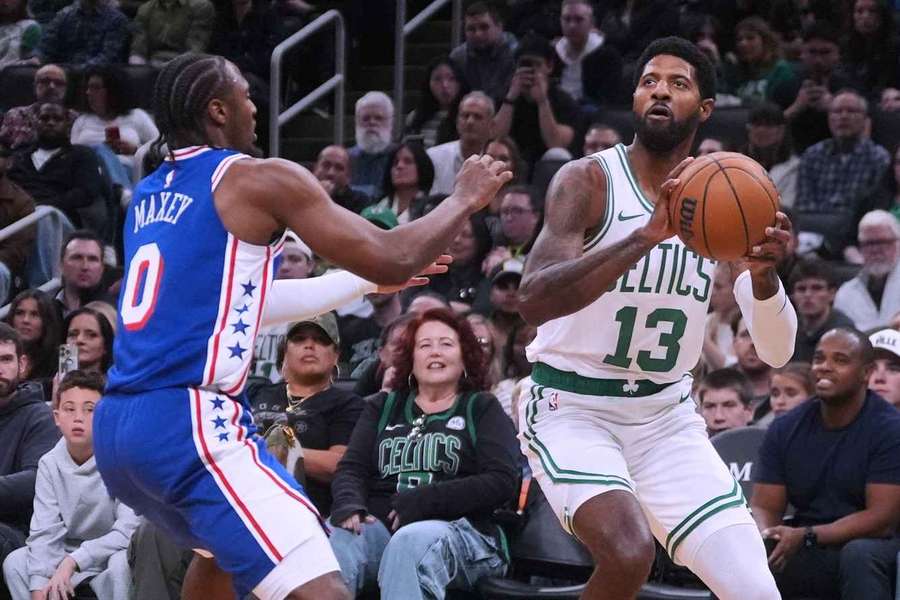 Paul George drives to the basket against Tyrese Maxey in the NBA preseason Paul George drives to the basket against Tyrese Maxey in the NBA preseason