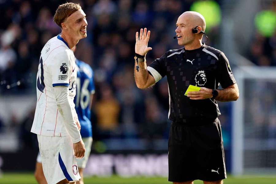 Referee Paul Tierney has words with Chelsea's Cole Palmer and shows him a yellow card Referee Paul Tierney has words with Chelsea's Cole Palmer and shows him a yellow card