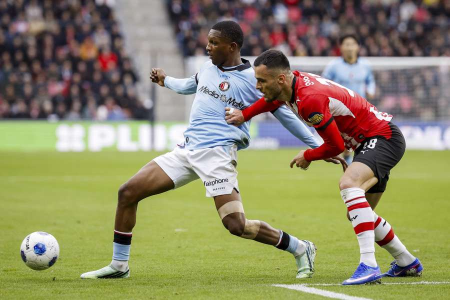PSV's Filip Kostic (R) battles with Givairo Read of Feyenoord PSV's Filip Kostic (R) battles with Givairo Read of Feyenoord