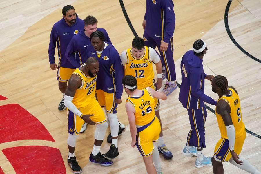 The Los Angeles Lakers celebrate winning a dramatic game in the NBA on Thursday.