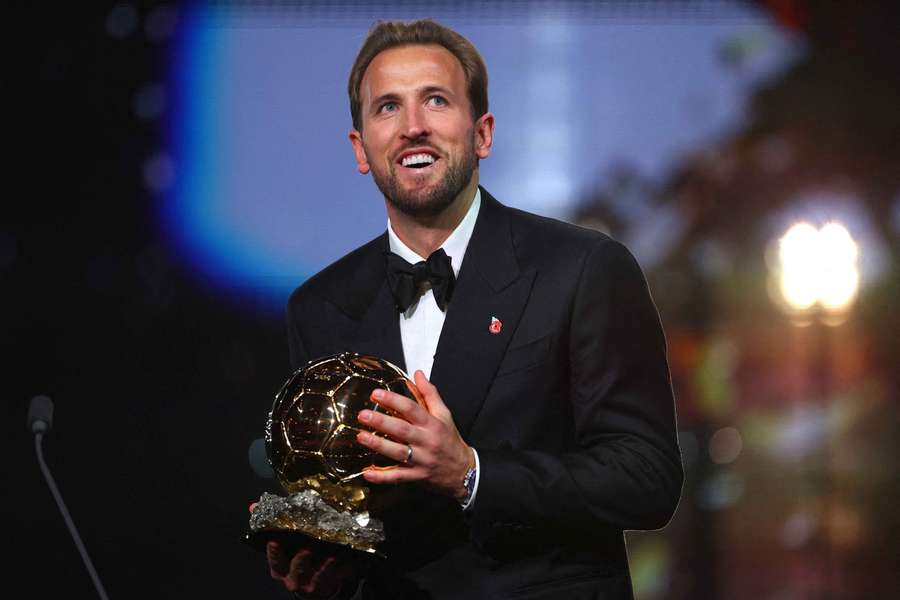 Harry Kane celebrates after winning the men's Ballon d'Or award Harry Kane celebrates after winning the men's Ballon d'Or award