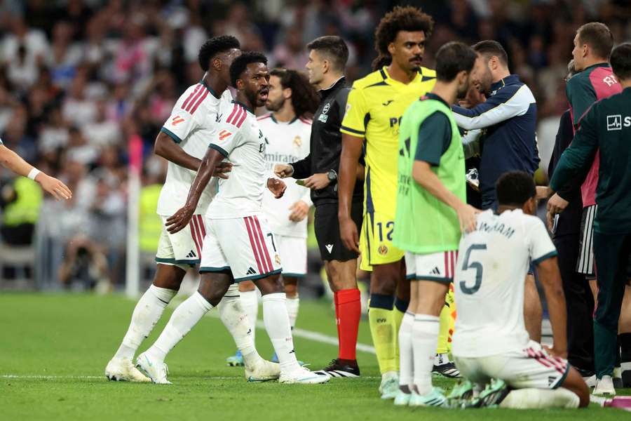 Real Madrid's Vinicius Junior reacts as he leaves the pitch Real Madrid's Vinicius Junior reacts as he leaves the pitch