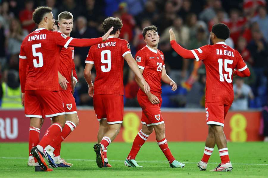 Wales' players celebrate against Norway Wales' players celebrate against Norway
